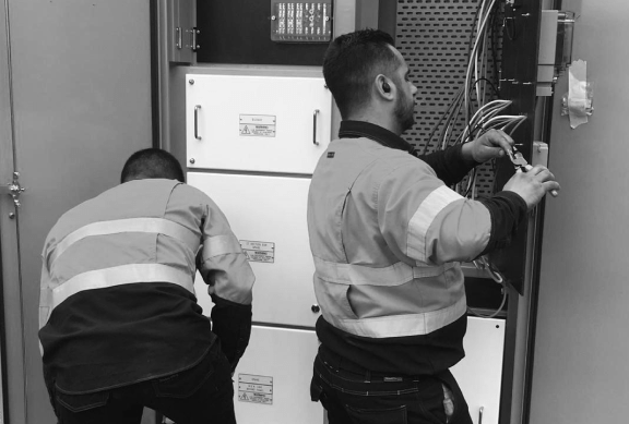 Level 2 Electricians in Sydney working on a swtichboard